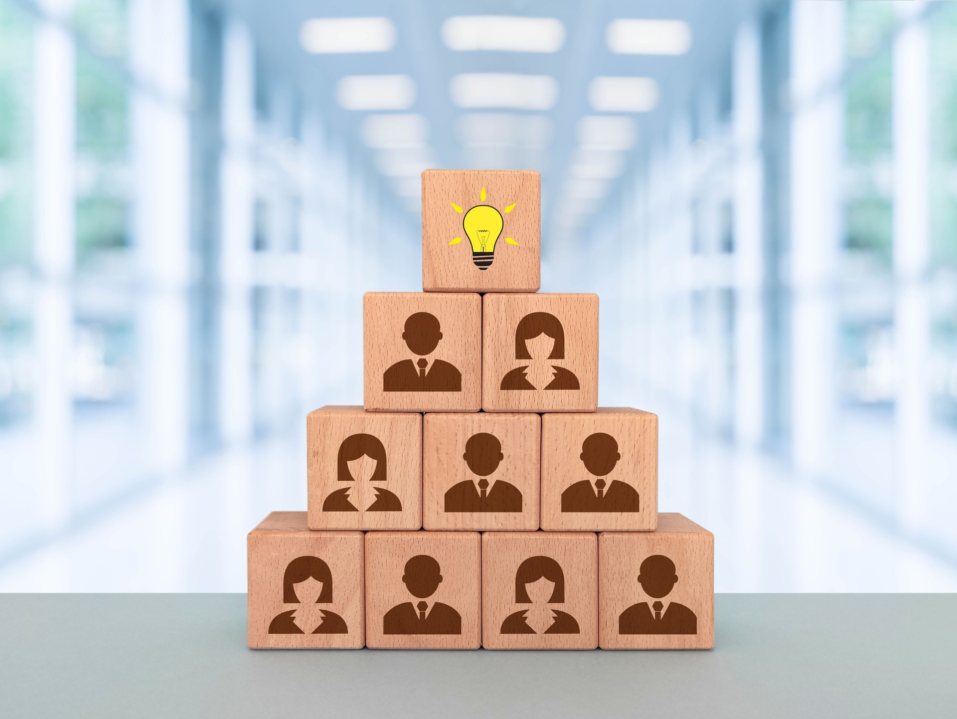 Creative idea and innovation concept, wooden cube blocks with business people symbol and light bulb icon
